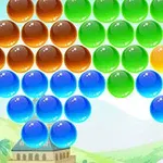 Színes gömbök, amelyek barna, zöld, sárga és kék színűek, háromszög alakzatban helyezkednek el