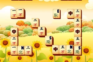 Mahjong lapok napraforgókkal teli mező fölött, háttérben felhős égbolt és dombok