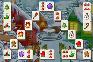 Téli táj színes karácsonyi motívumokkal díszített mahjong kövek előtt, havas tetőkkel és fenyőkkel