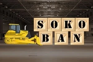 Egy sárga buldózer előtt hat fa láda látható egy raktárban, a ládák SOKOBAN felirattal