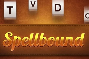 Bőrhatású háttér előtt Spellbound felirat, fölötte fehér kockákon fekete betűk: T, V, D, O