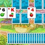Kártyajáték készlet különböző gyümölcs szimbólumokkal egy színes piac háttér előtt