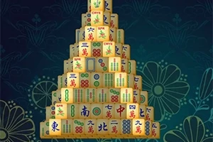 Egy színes mahjong csempe piramis virágmintás háttér előtt