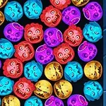 Színes, arckifejezést mutató tökfejek keveréke, különböző kifejezésekkel és színekben egy kék szélű keretben